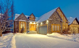 Photo of exterior of home in the snow by Calgary and Vancouver Island Photographer